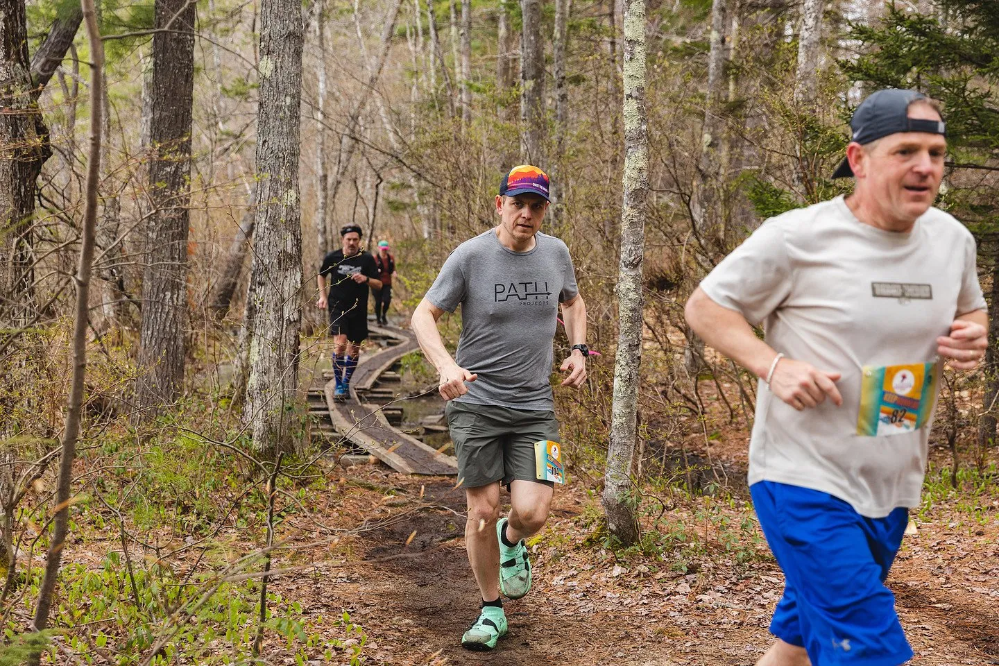 Runners on the shoreline trail