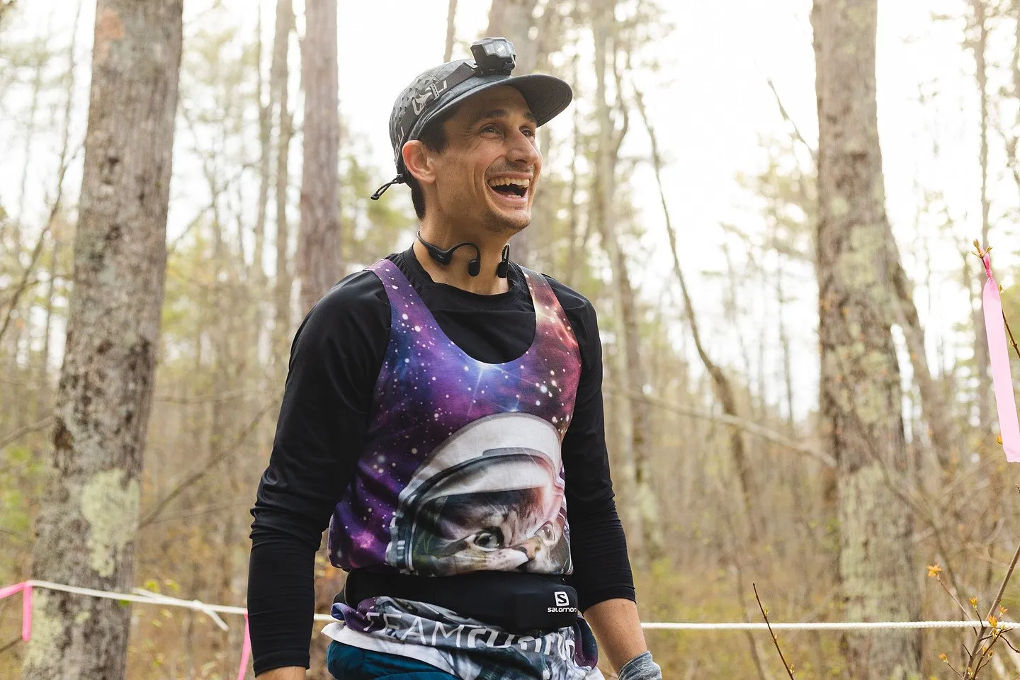 A runner celebrating at the finish