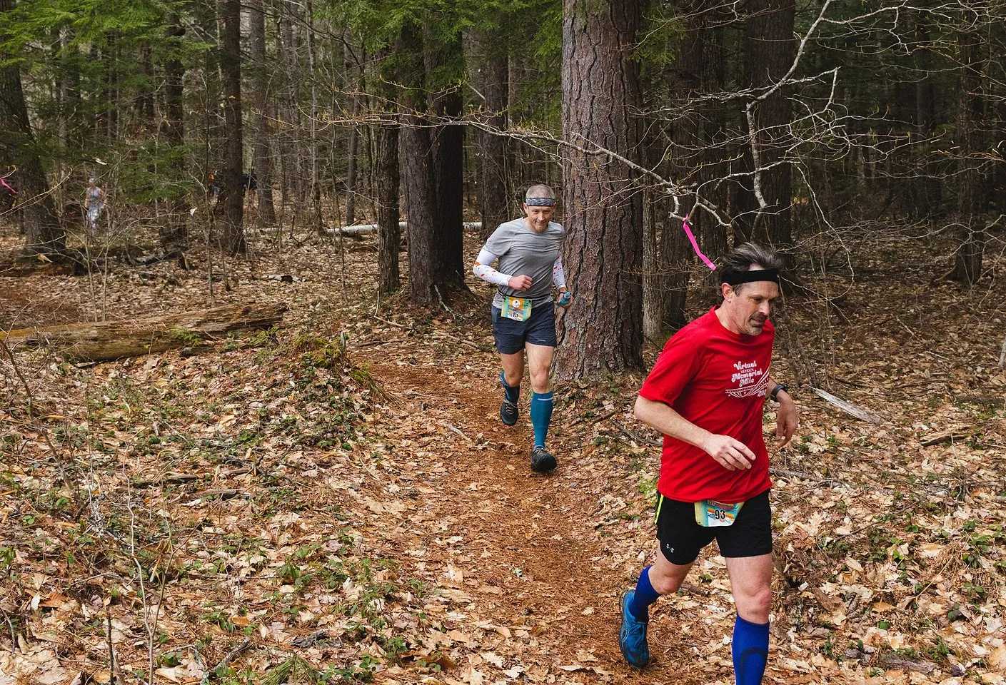 Runners on the pine needle singletrack