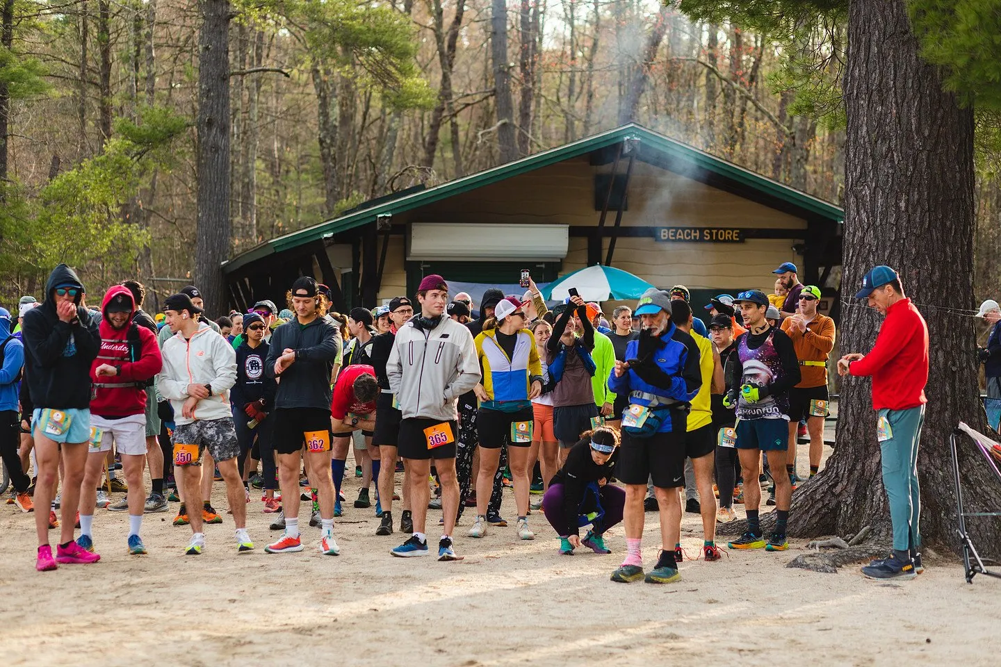 The field gathered under the pines at the start