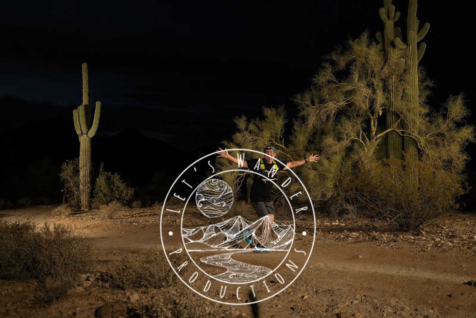 Runners among the saguaros at the Sinister Night Runs in San Tan Mountain Regional Park