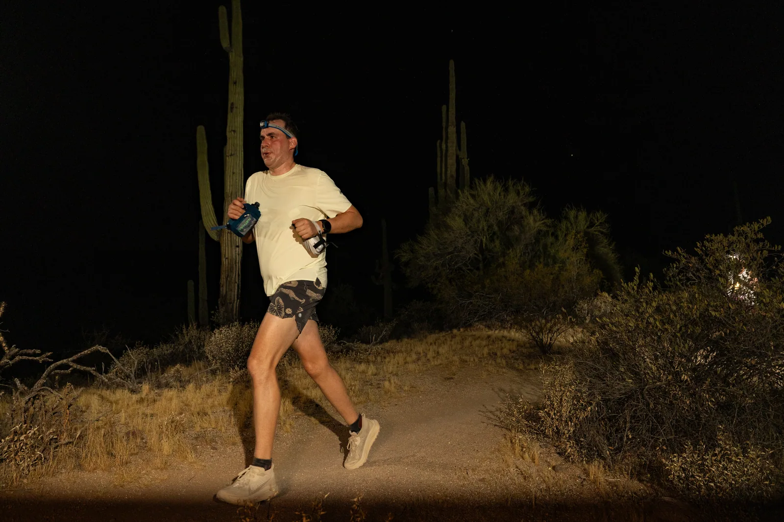 Runners by headlamp at the Adrenaline Night Runs in McDowell Mountain Regional Park