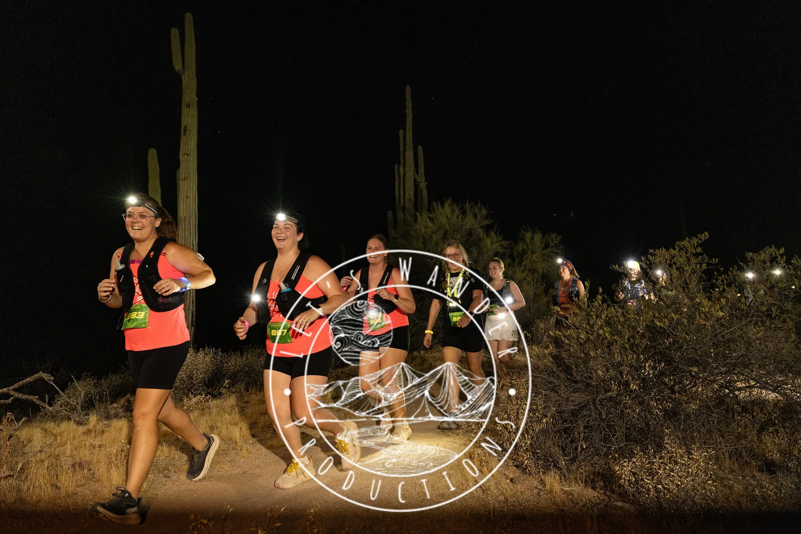 Runners by headlamp at the Adrenaline Night Runs in McDowell Mountain Regional Park