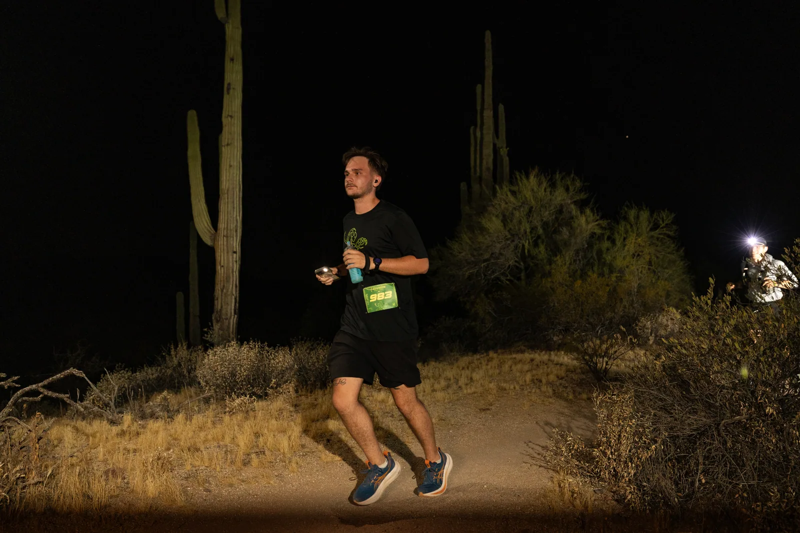 Runners by headlamp at the Adrenaline Night Runs in McDowell Mountain Regional Park