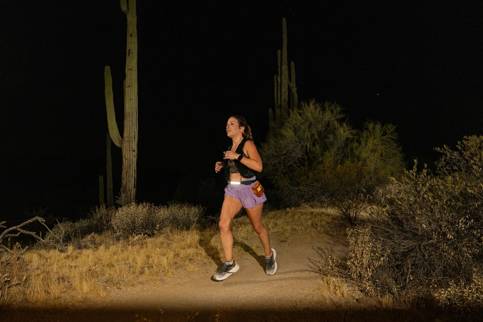 Runners by headlamp at the Adrenaline Night Runs in McDowell Mountain Regional Park