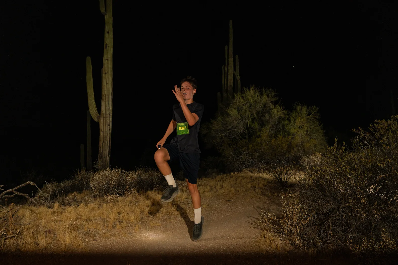 Runners by headlamp at the Adrenaline Night Runs in McDowell Mountain Regional Park