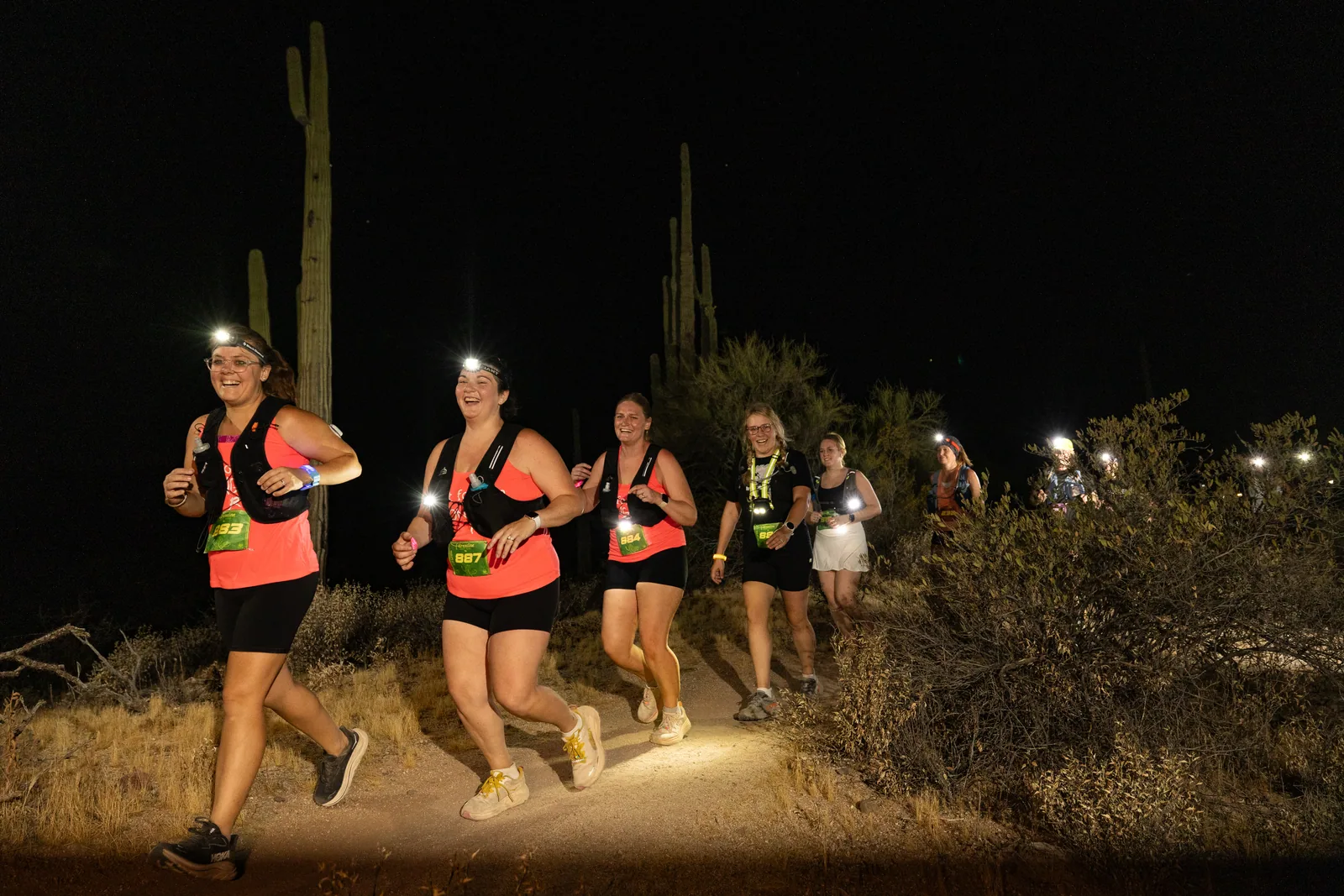 Runners by headlamp at the Adrenaline Night Runs in McDowell Mountain Regional Park
