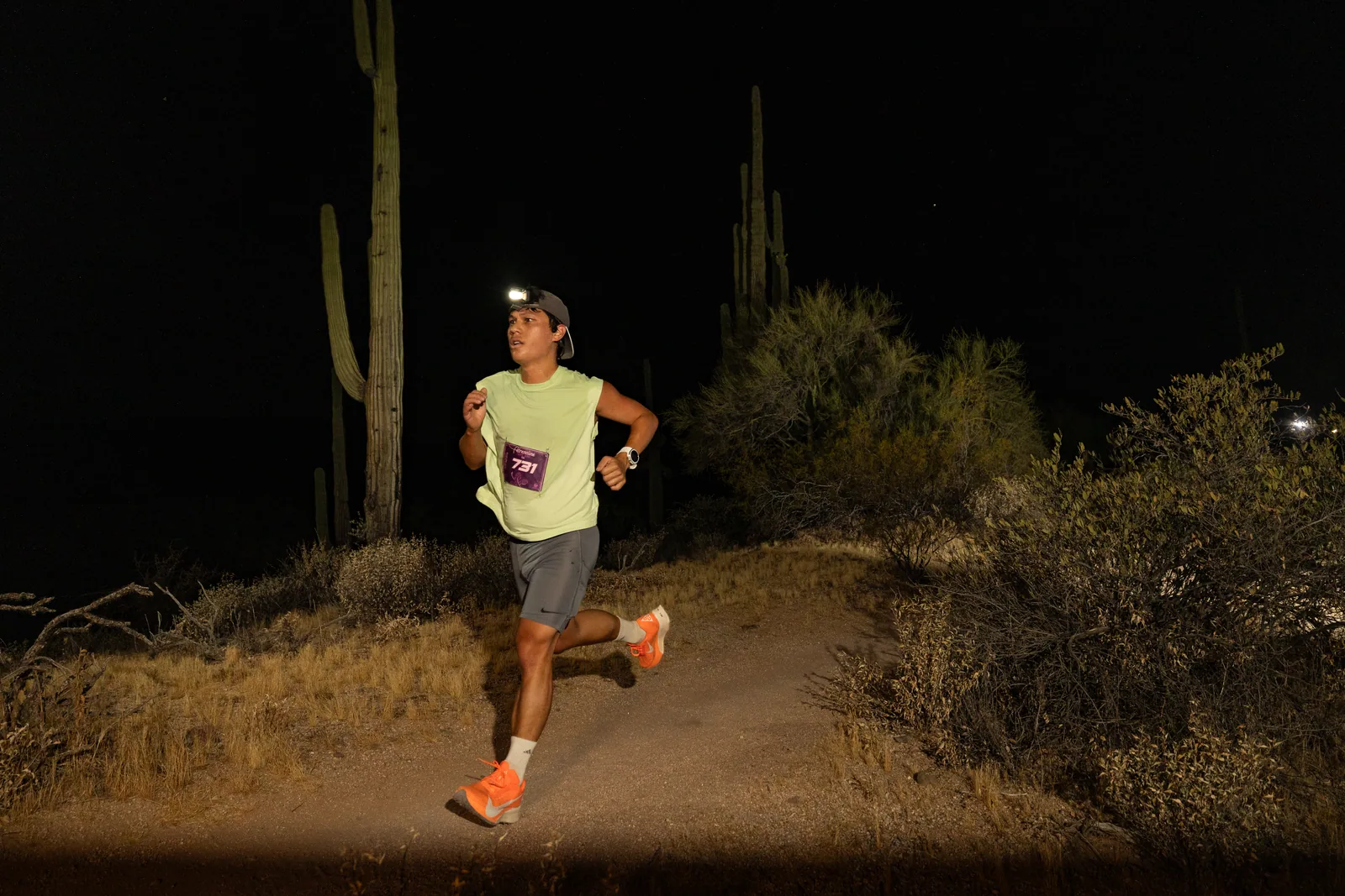 Runners by headlamp at the Adrenaline Night Runs in McDowell Mountain Regional Park