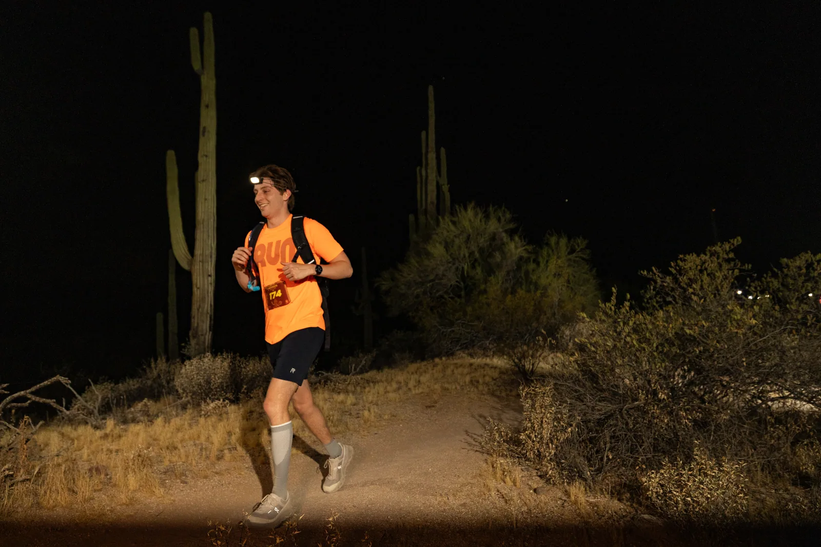 Runners by headlamp at the Adrenaline Night Runs in McDowell Mountain Regional Park
