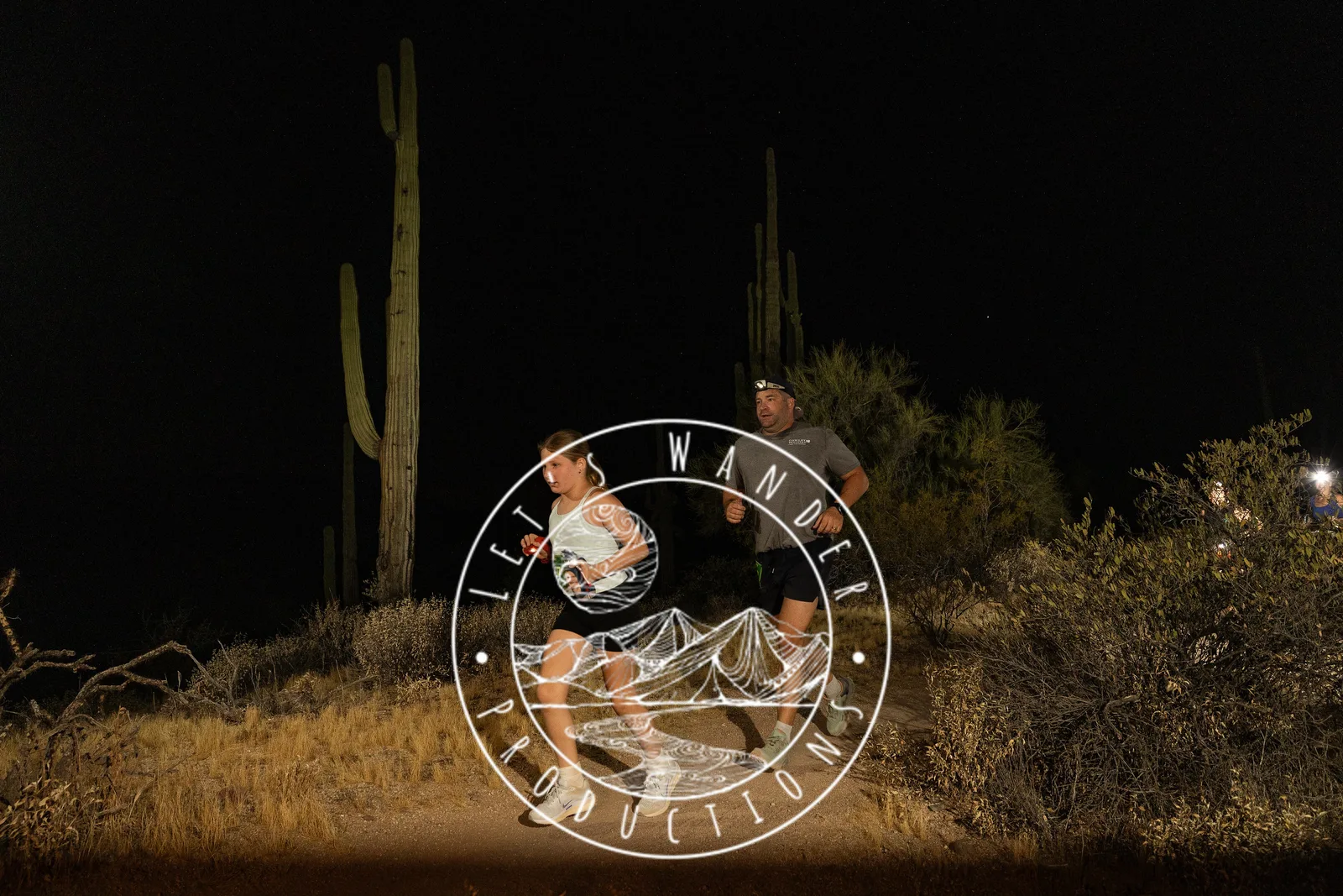 Runners by headlamp at the Adrenaline Night Runs in McDowell Mountain Regional Park