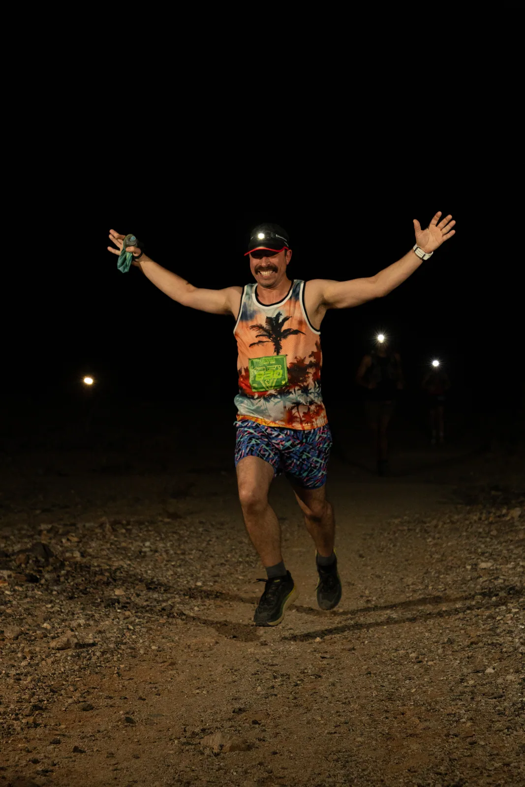 Runners by headlamp at the Hypnosis Night Runs at Estrella Mountain