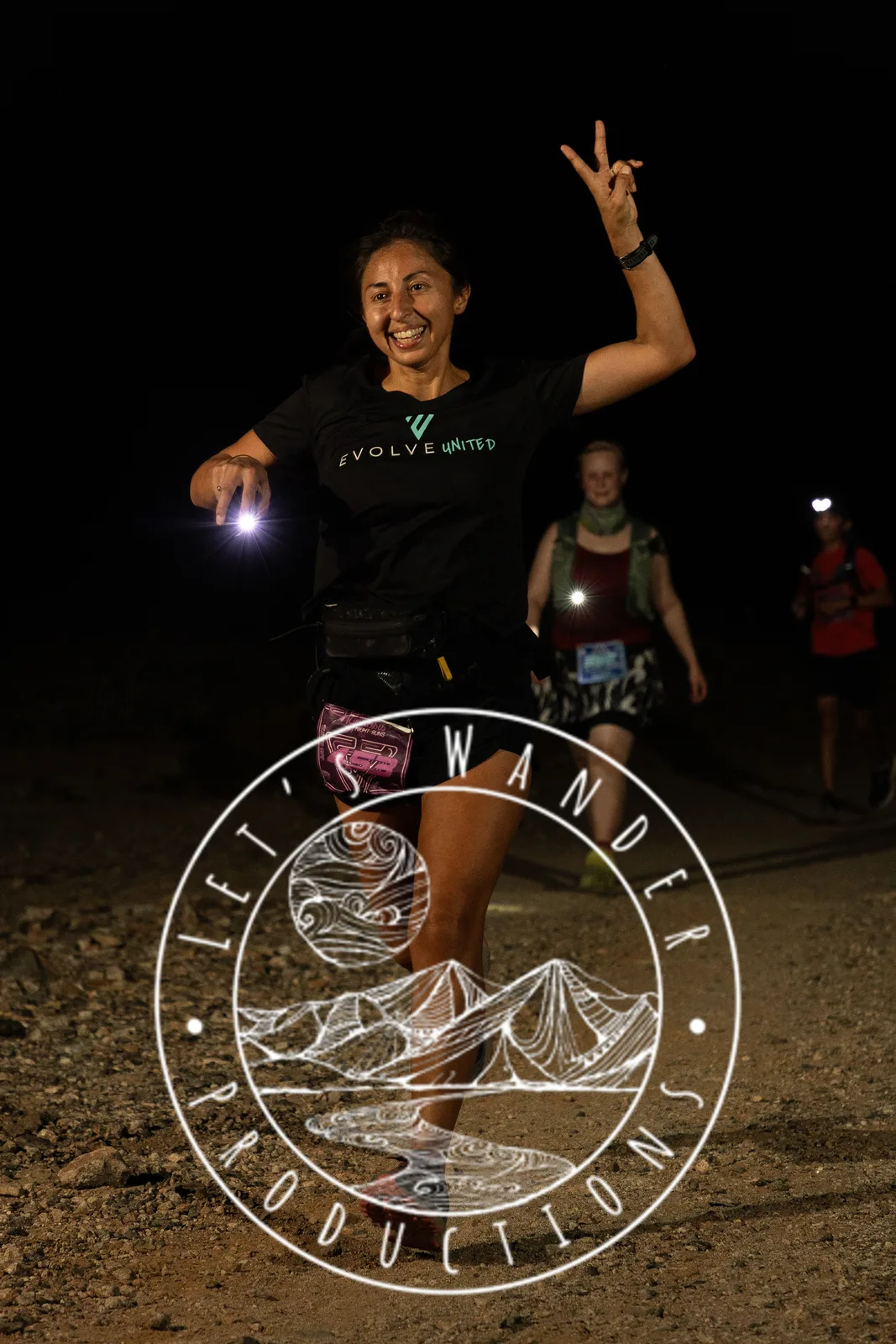 Runners by headlamp at the Hypnosis Night Runs at Estrella Mountain