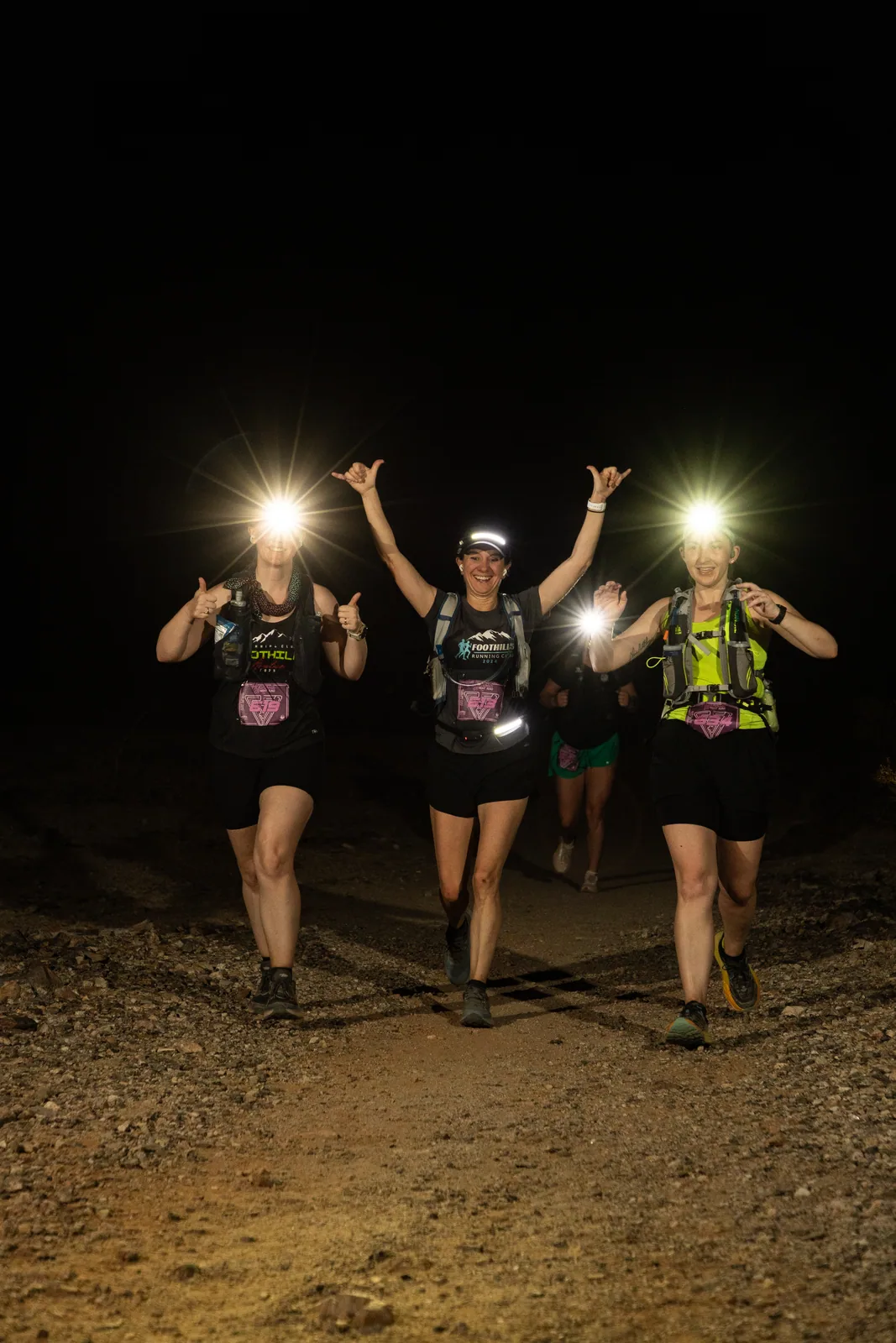 Runners by headlamp at the Hypnosis Night Runs at Estrella Mountain