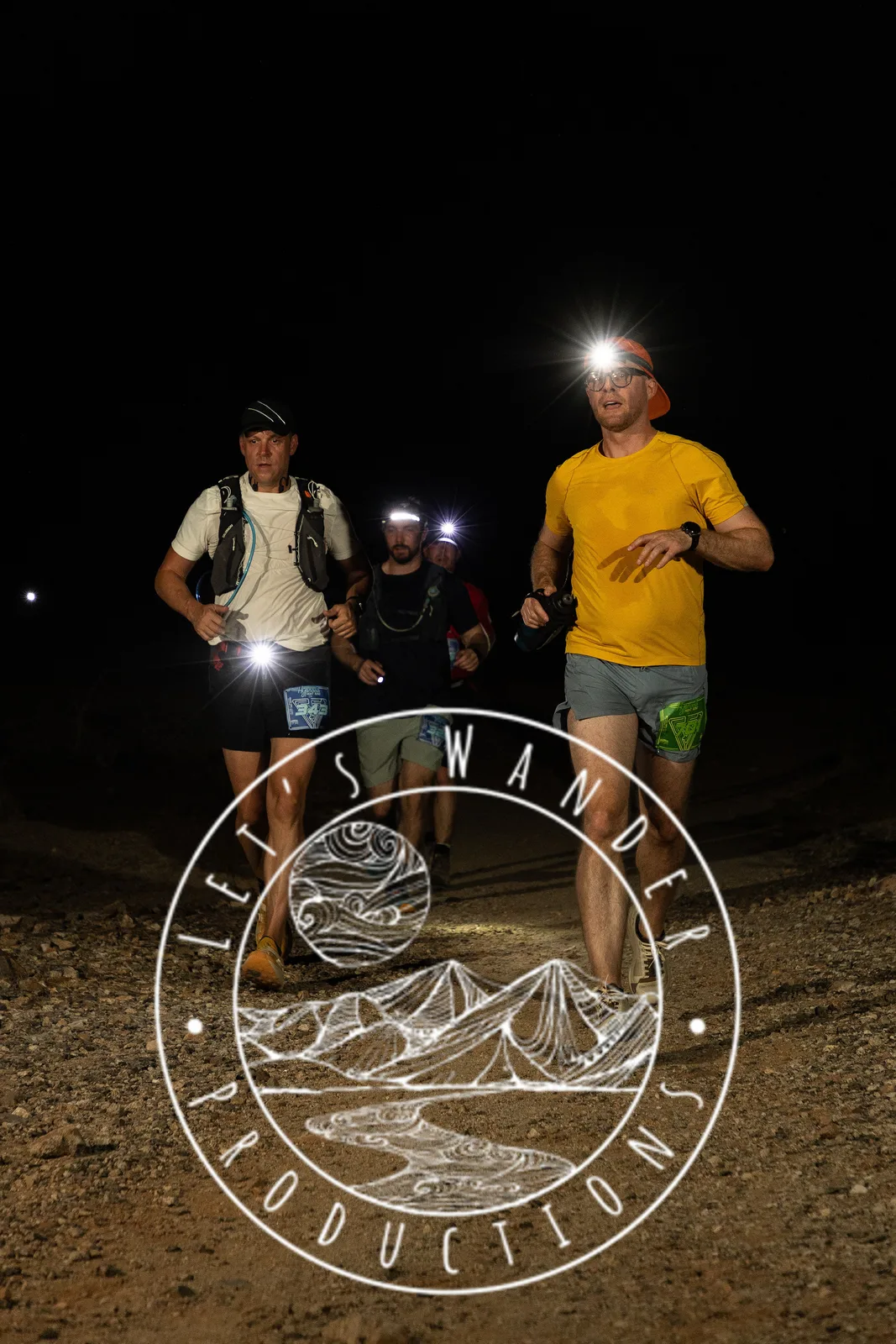 Runners by headlamp at the Hypnosis Night Runs at Estrella Mountain