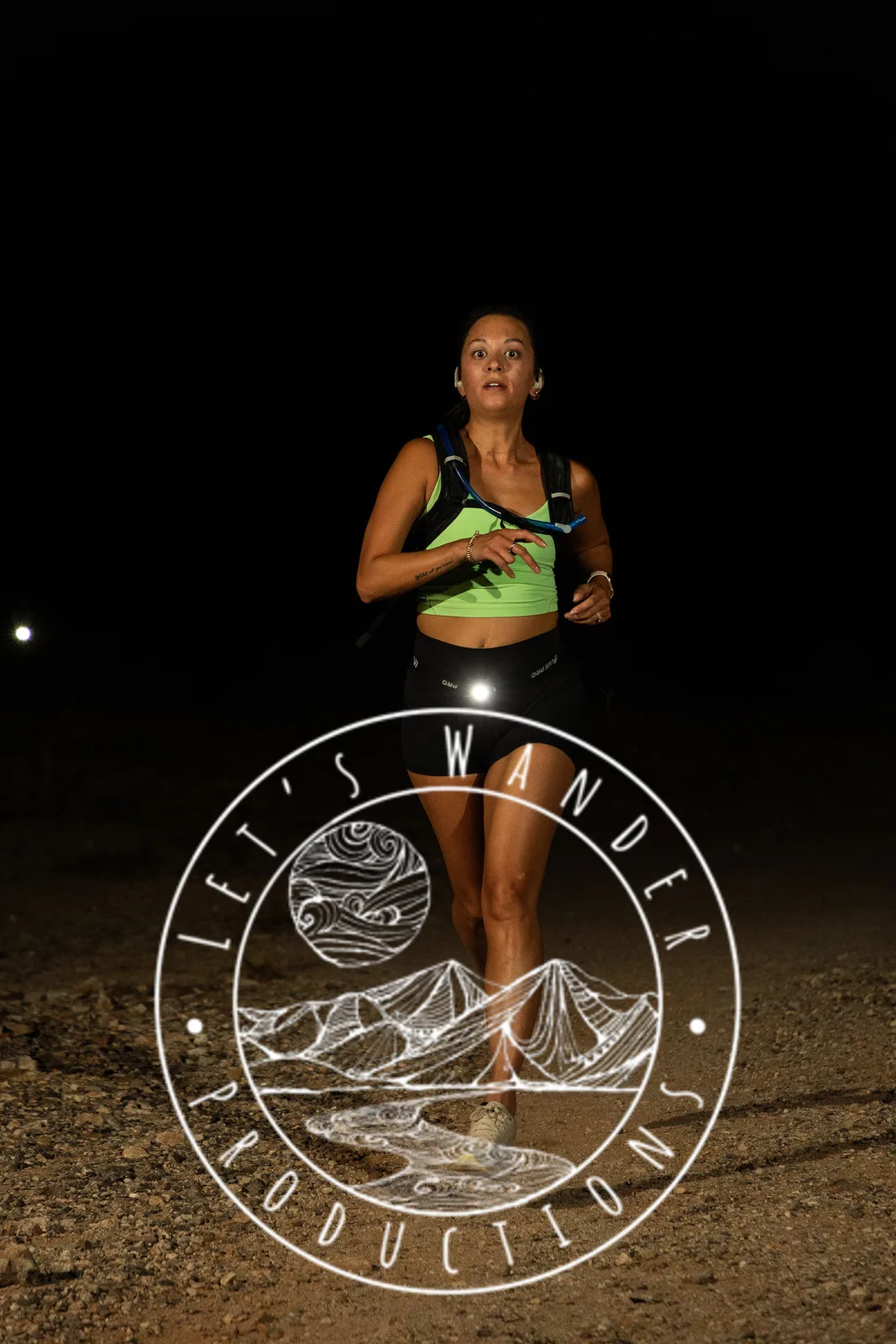 Runners by headlamp at the Hypnosis Night Runs at Estrella Mountain