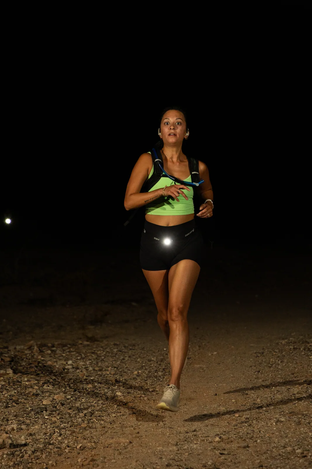 Runners by headlamp at the Hypnosis Night Runs at Estrella Mountain