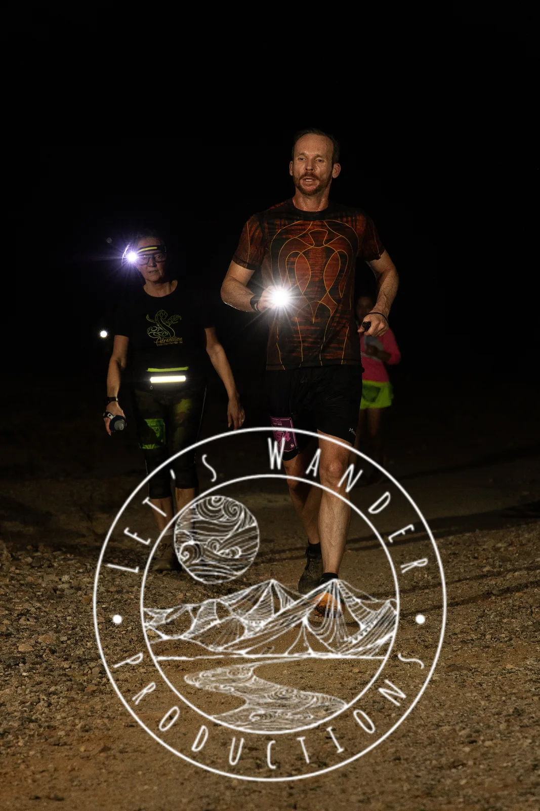 Runners by headlamp at the Hypnosis Night Runs at Estrella Mountain