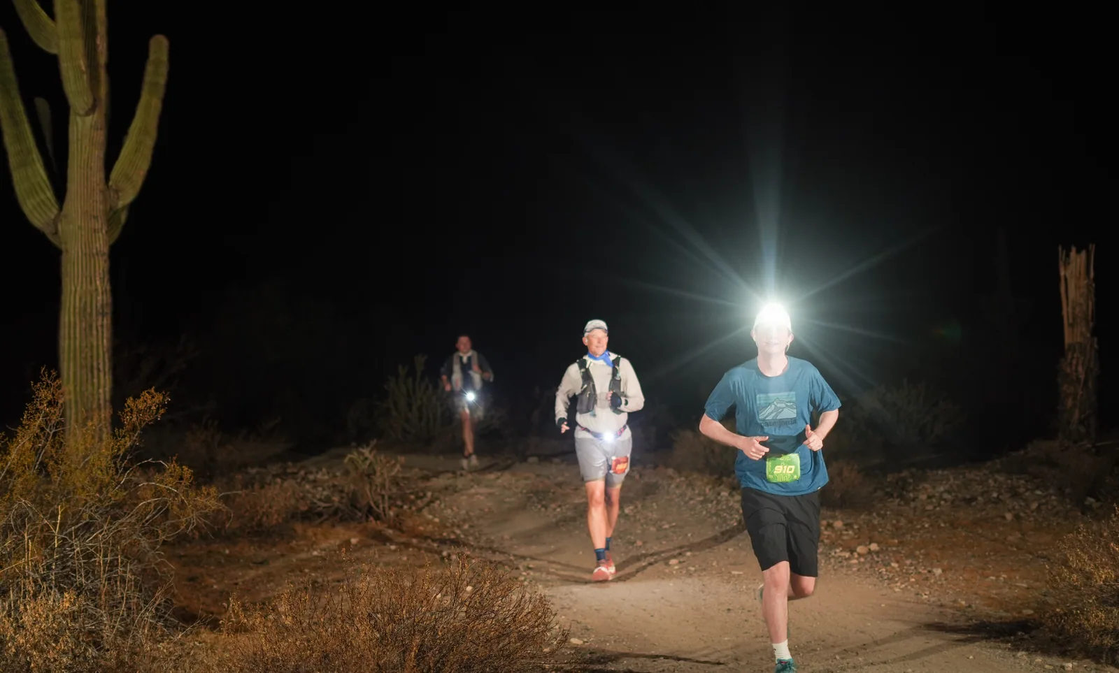 Runners by headlamp at the Vertigo Night Runs in White Tank Mountain Regional Park