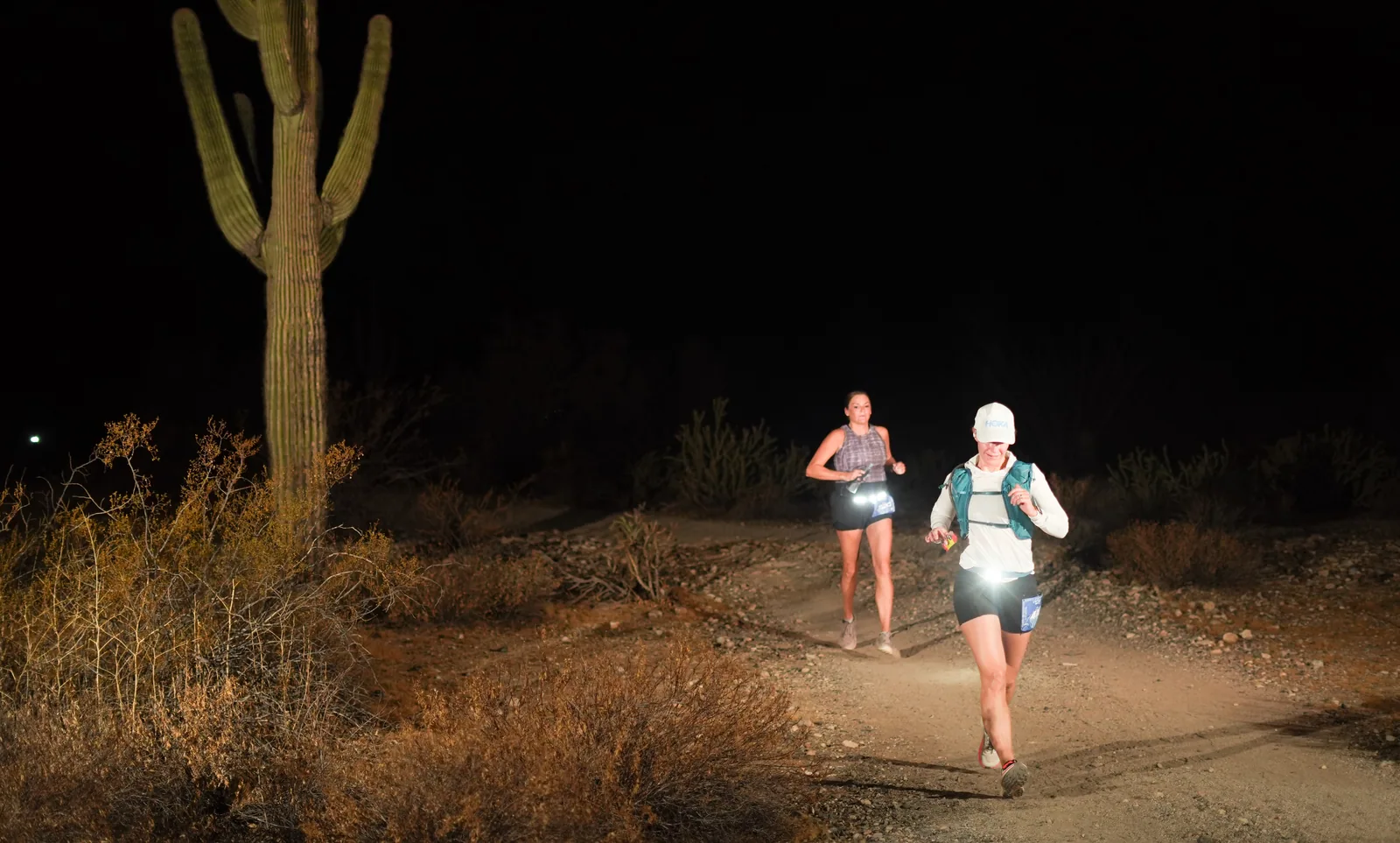 Runners by headlamp at the Vertigo Night Runs in White Tank Mountain Regional Park