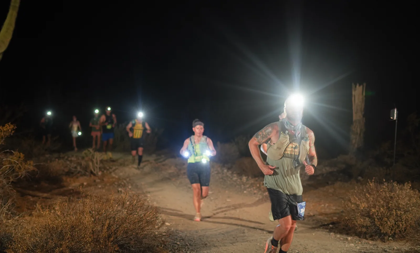 Runners by headlamp at the Vertigo Night Runs in White Tank Mountain Regional Park