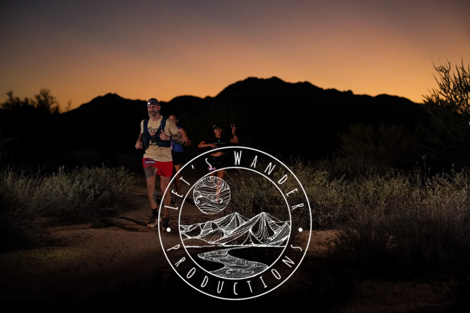 Runners at dusk and by headlamp at the Javelina Jangover Night Runs in McDowell Mountain Regional Park