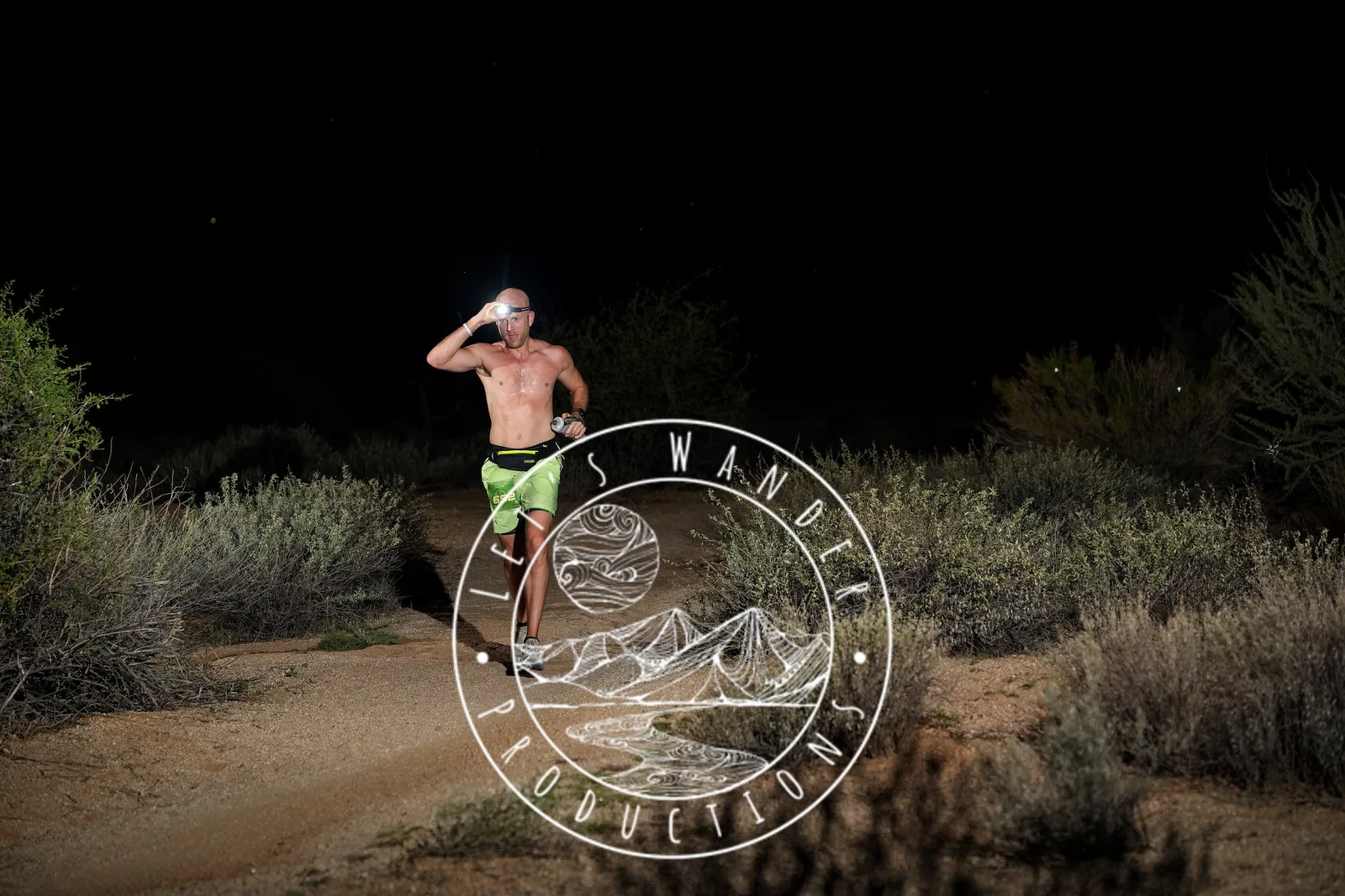 Runners at dusk and by headlamp at the Javelina Jangover Night Runs in McDowell Mountain Regional Park