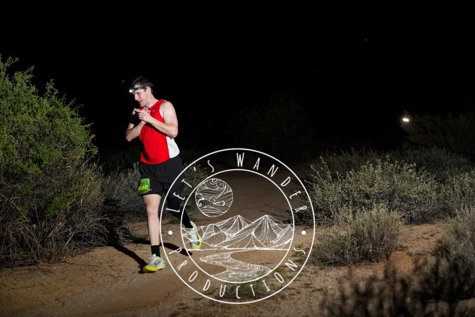 Runners at dusk and by headlamp at the Javelina Jangover Night Runs in McDowell Mountain Regional Park