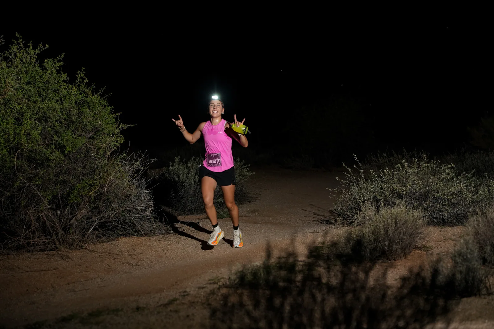 Runners at dusk and by headlamp at the Javelina Jangover Night Runs in McDowell Mountain Regional Park