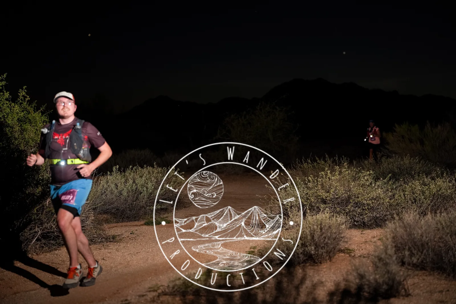 Runners at dusk and by headlamp at the Javelina Jangover Night Runs in McDowell Mountain Regional Park