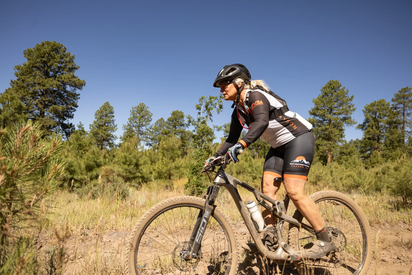 Rider on the Big Woody Rides loop in the pines near Flagstaff