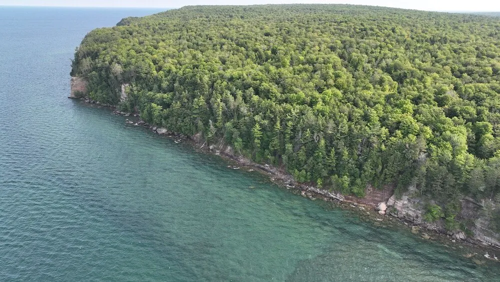 Grand Island's forested cliffs over Lake Superior