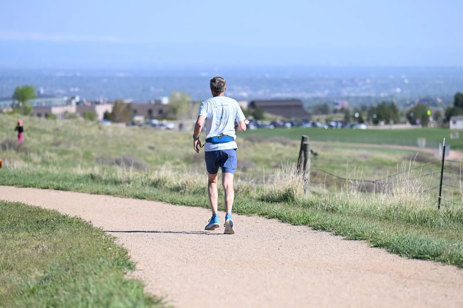 A runner with Denver in the distance