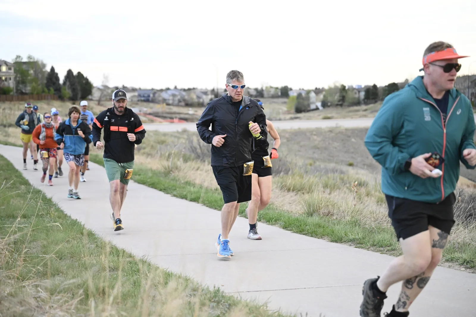 A line of runners on the trail