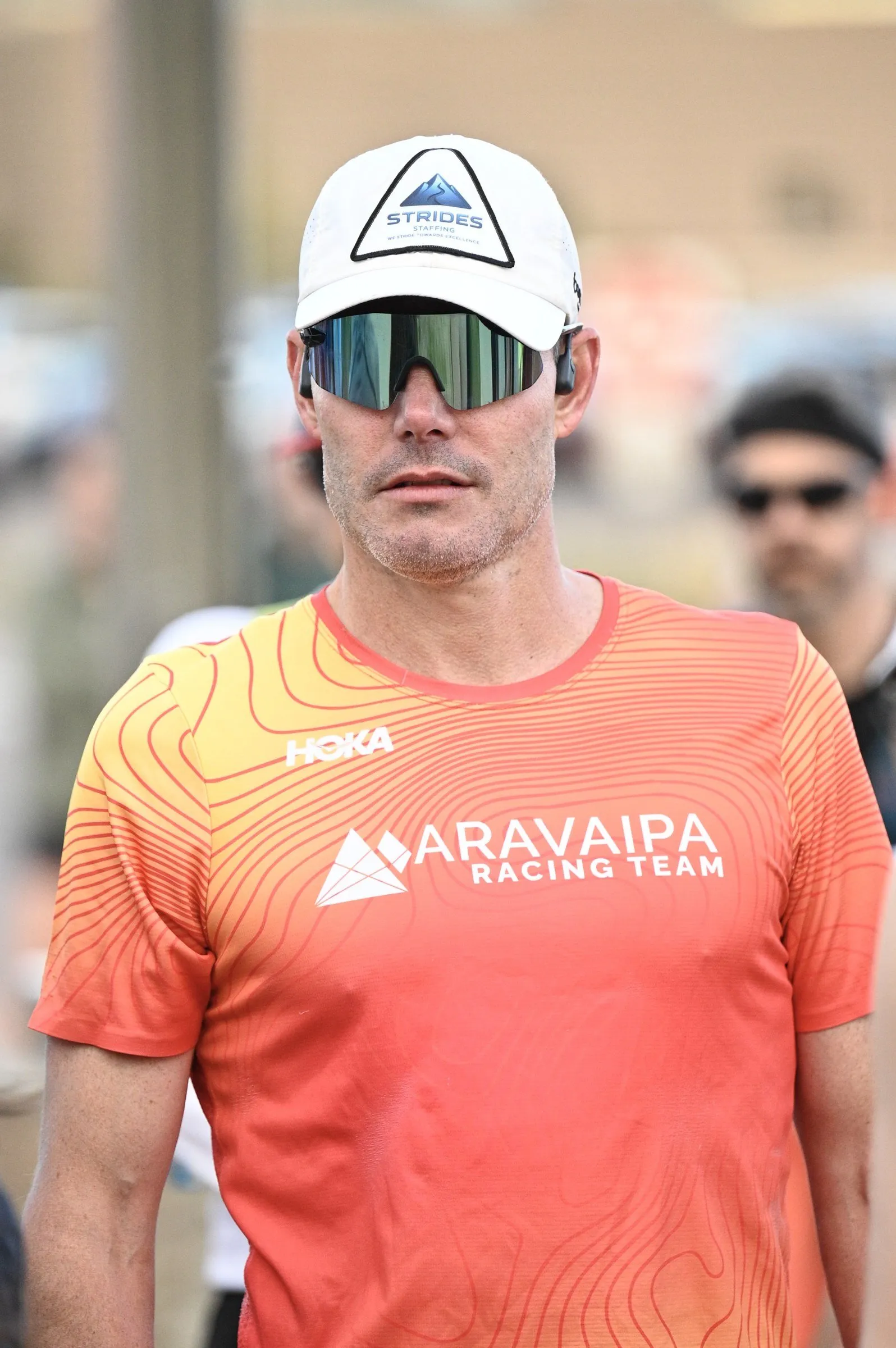 A runner in an Aravaipa shirt waiting for the start