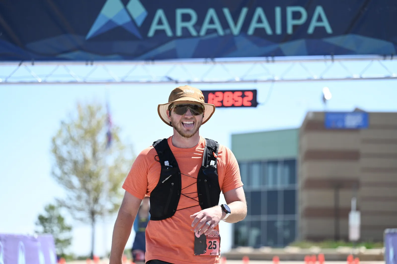 A runner finishing under the Aravaipa arch