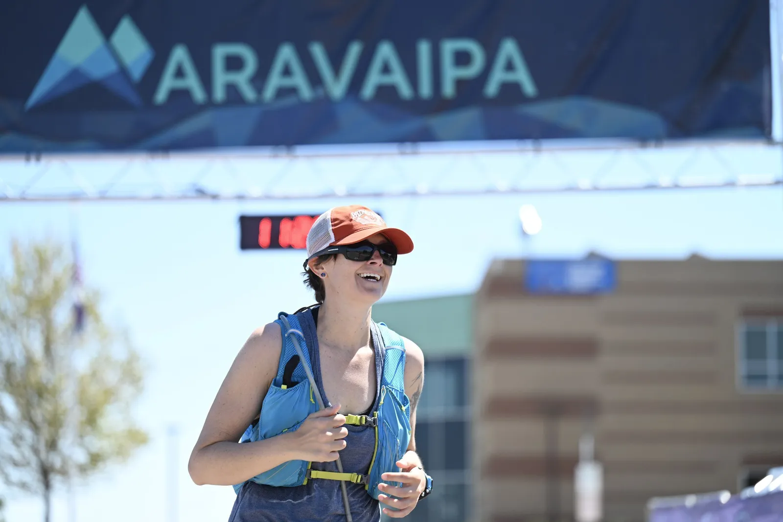 A runner smiling at the finish