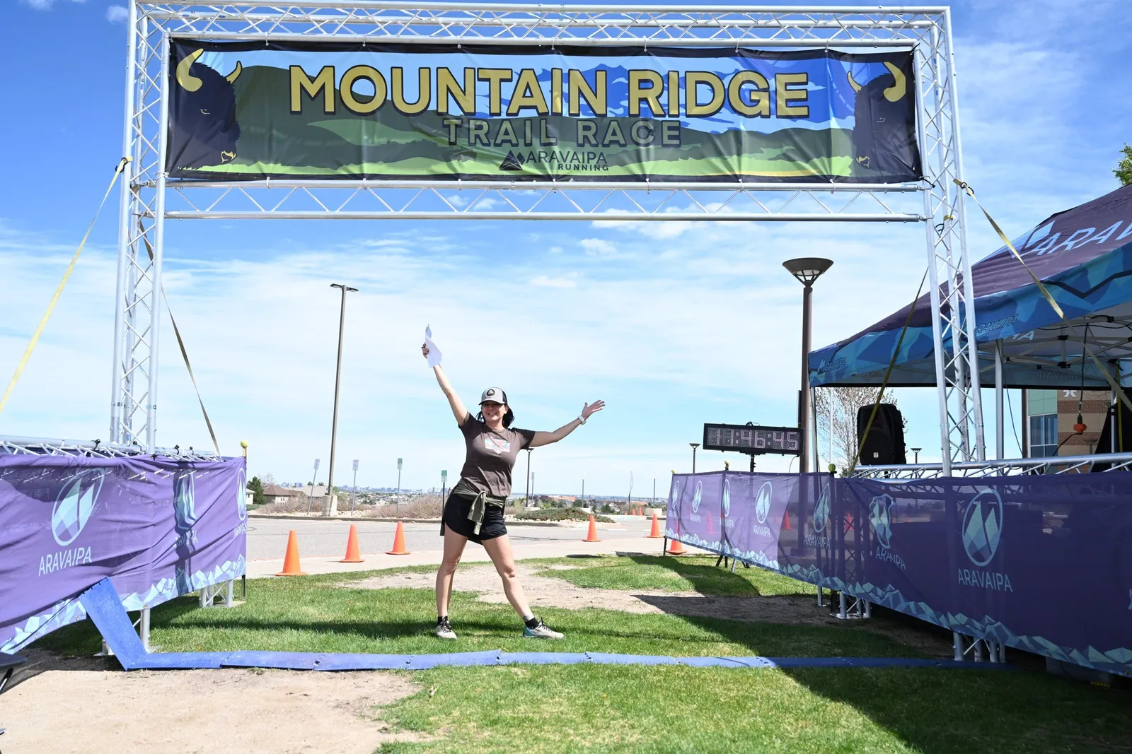 A runner leaping at the finish