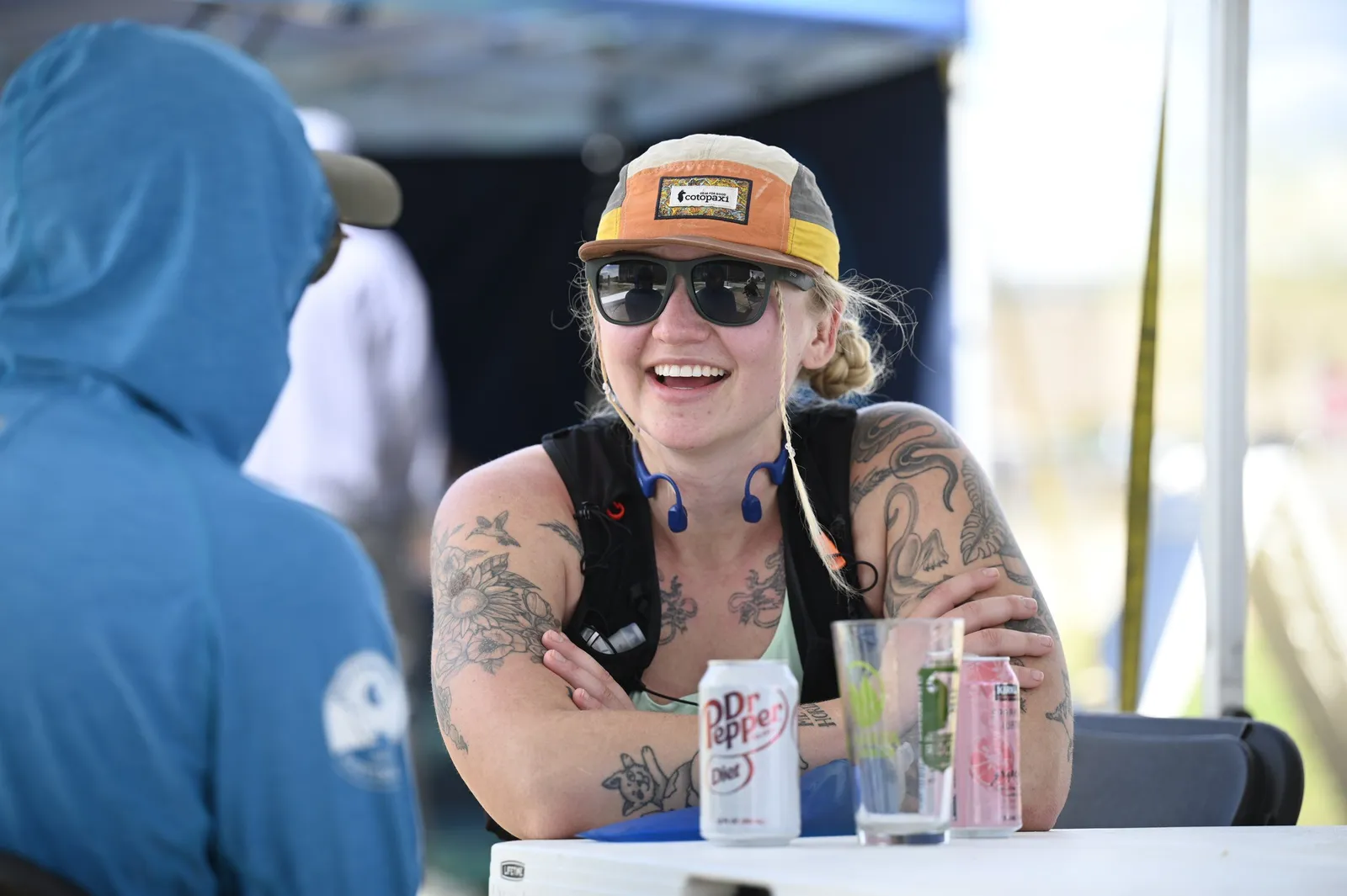 A finisher laughing with friends after the race