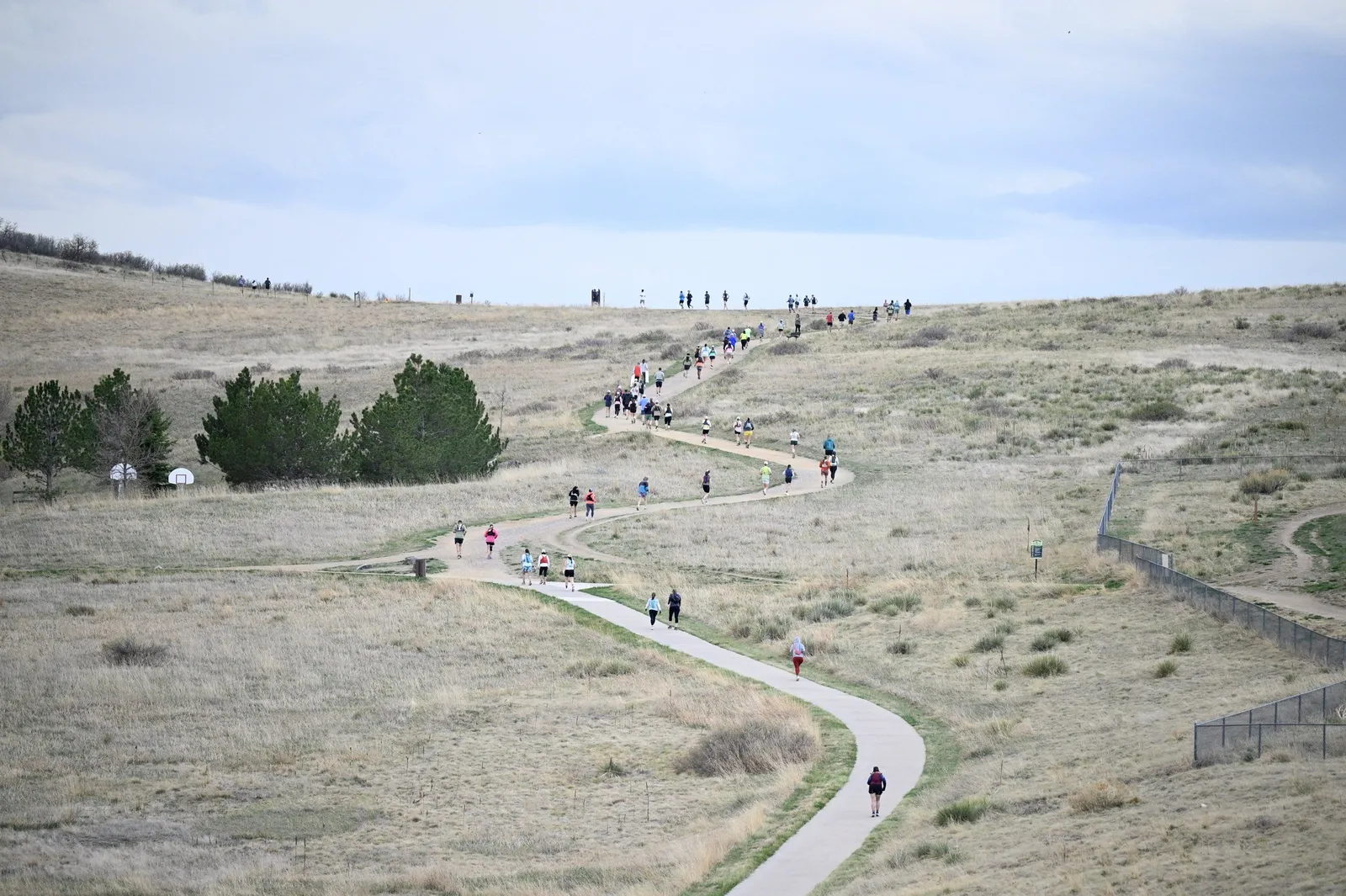 The trail winding across the open hills