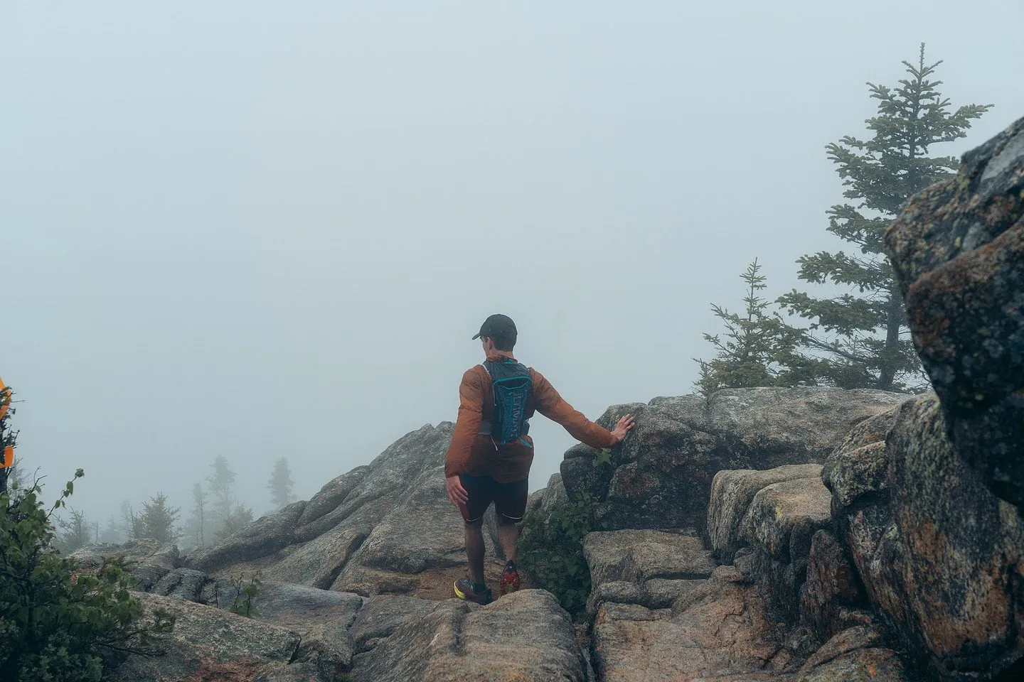 Runner working along the summit ledges