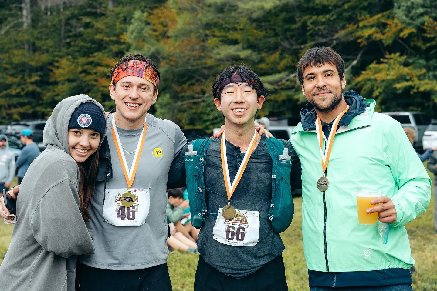 Finishers with medals and a drink at the finish