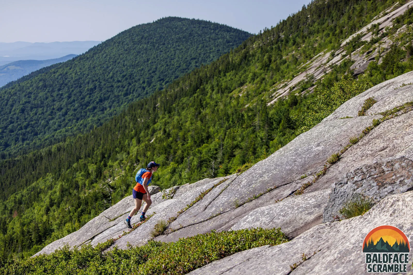 A runner on the long granite slab above the valley