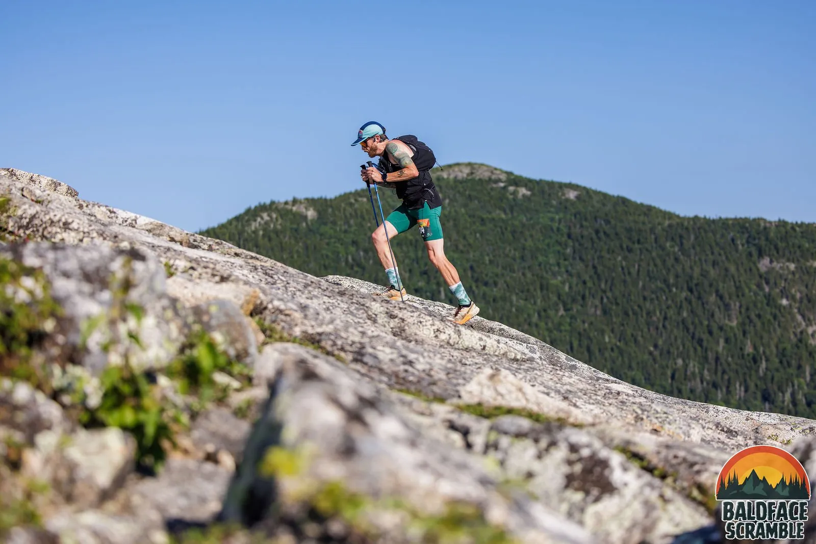 Runner charging up the slab toward the summit