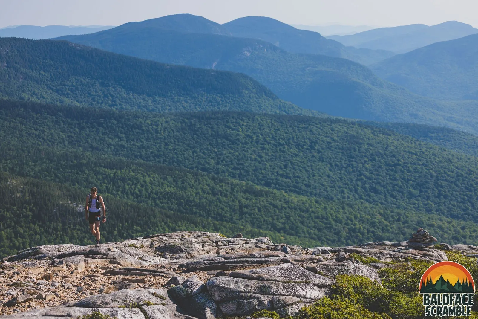 A lone runner on the granite high above the valley