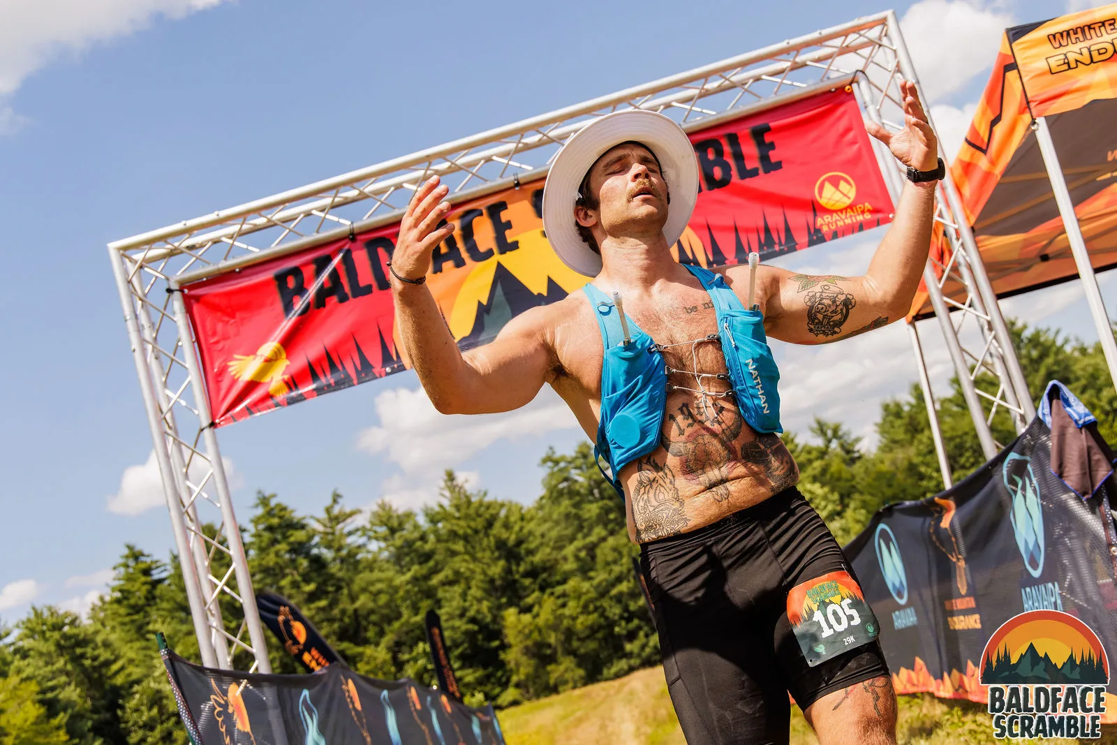 Arms out under the finish arch