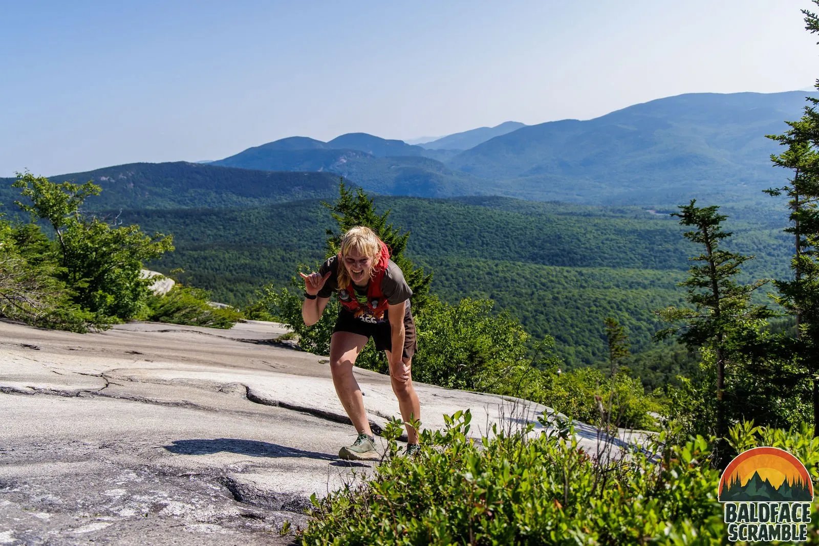 Runner on the slabs with the mountains behind