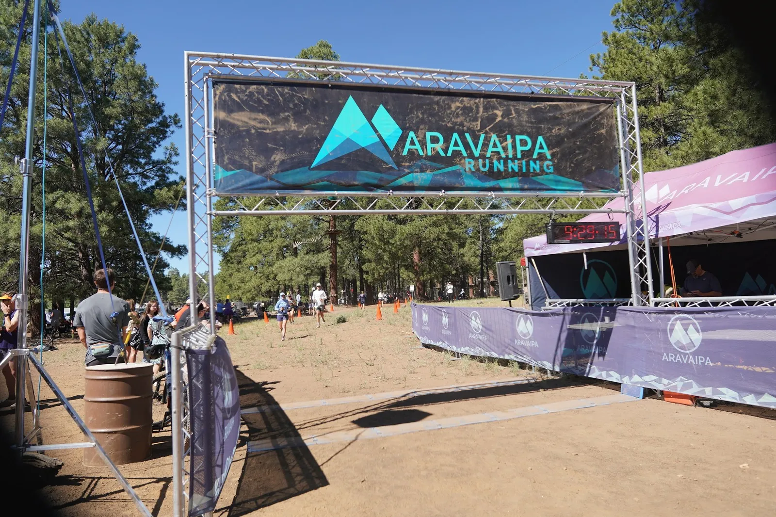 A wide view of the Big Pine Trail Runs finish line in the Flagstaff ponderosa pines