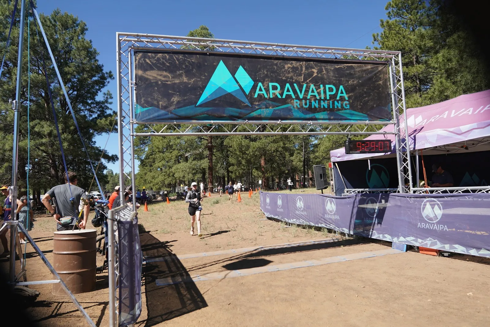 A runner on the final stretch at the Big Pine Trail Runs finish line in the Flagstaff ponderosa pines