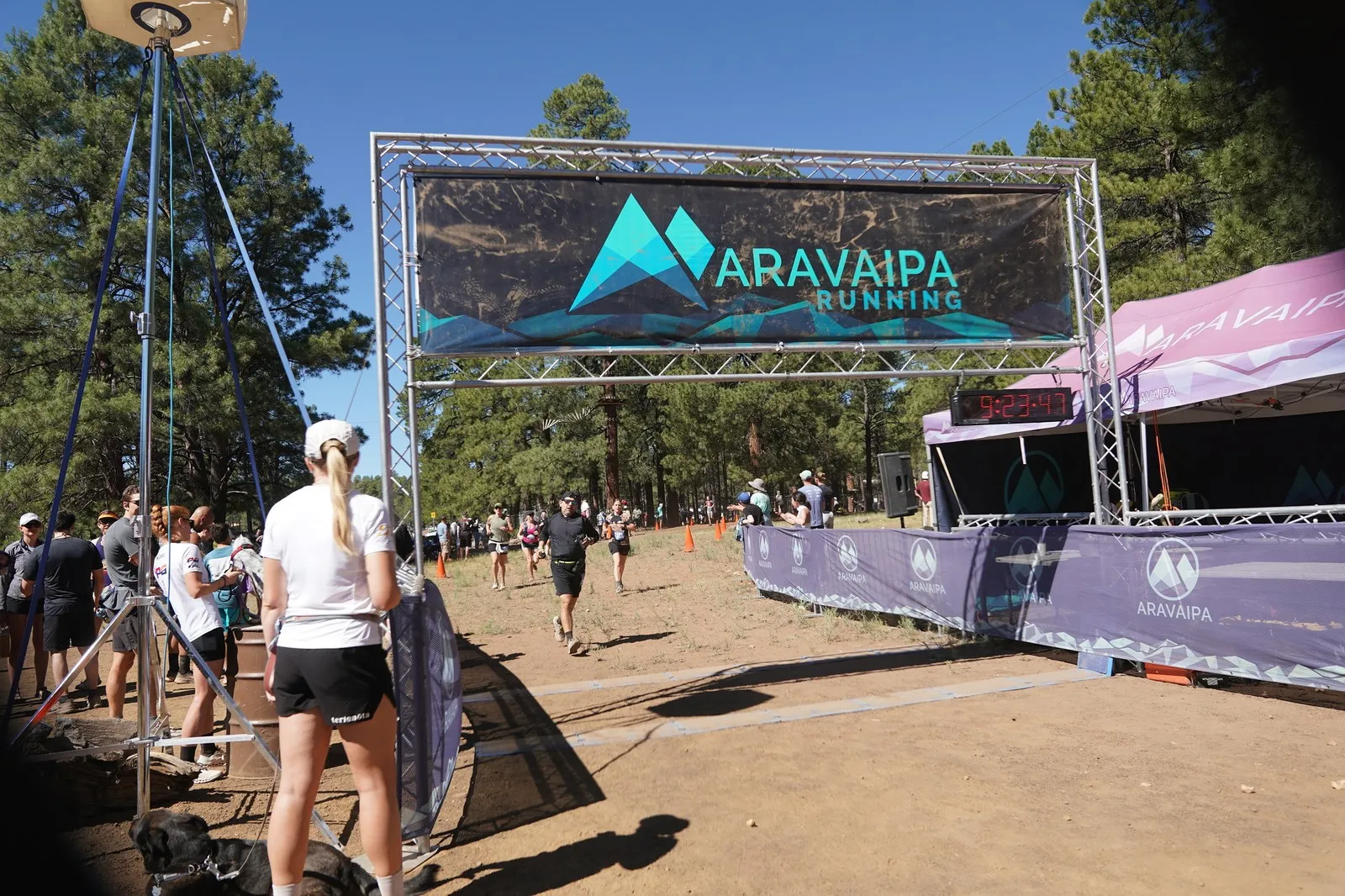 Runners and spectators at the Big Pine Trail Runs finish line in the Flagstaff ponderosa pines