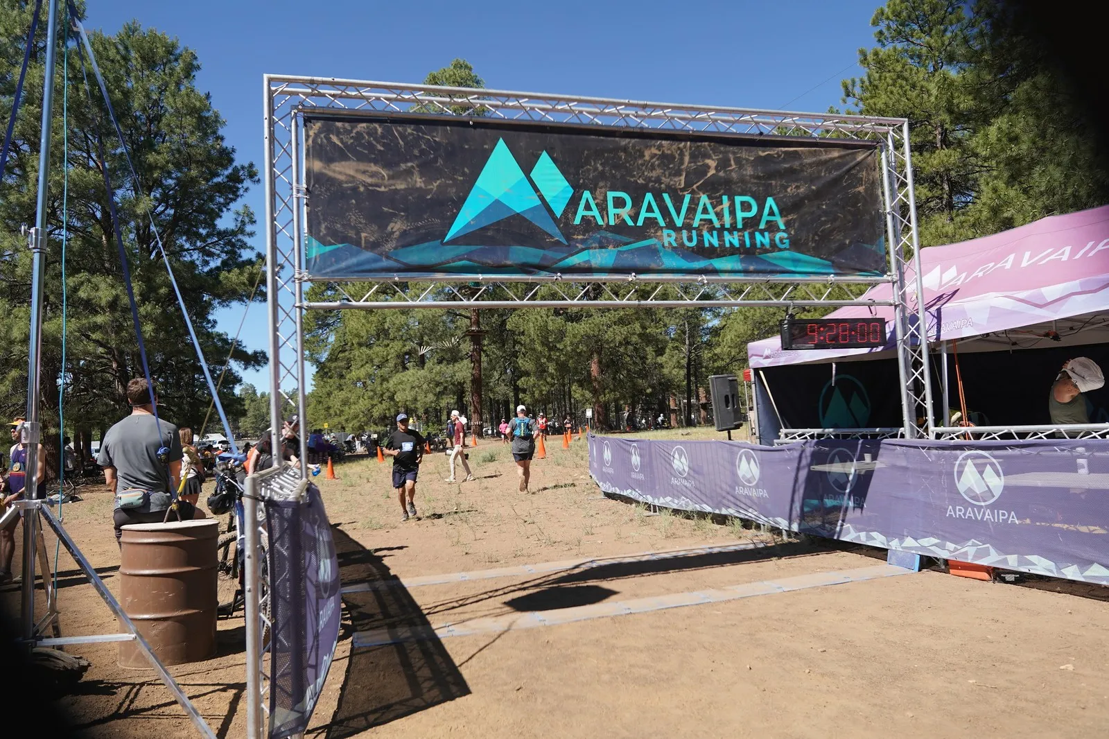 Runners approaching the Big Pine Trail Runs finish line in the Flagstaff ponderosa pines